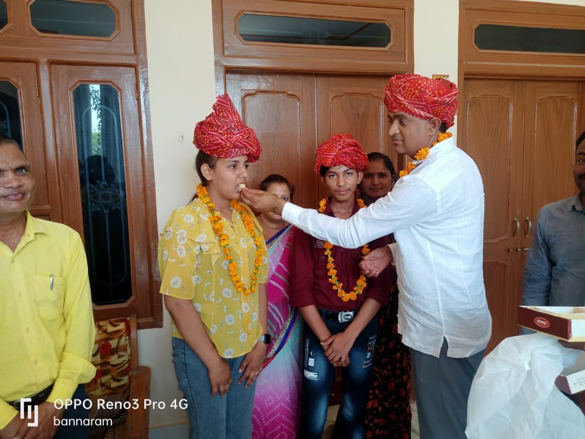 Founder Deepak Chand Saini celebrating with school toppers